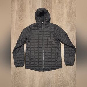 The North Face Boy's, ThermoBall Eco hooded jacket in black. 